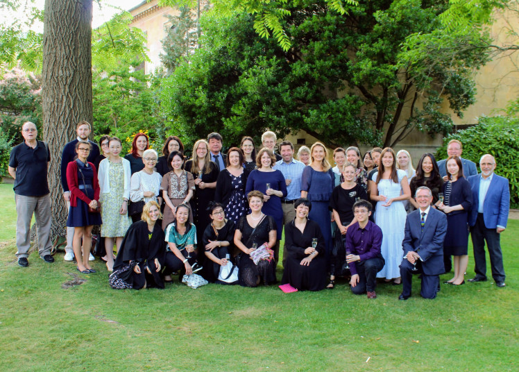 Summer School participants pose for a group photo in the grounds of Emmanuel College, Cambridge